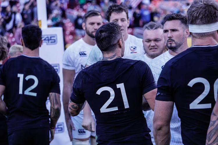All Blacks players shake hands with the US players after the match in Washington.