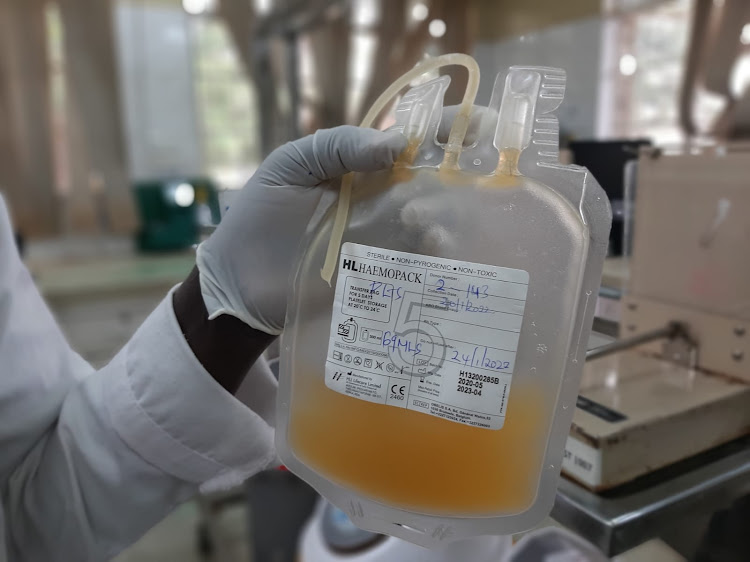 A doctor carrying platelets in Nakuru. /Nancy Agutu