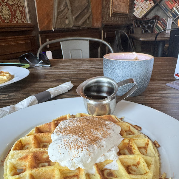 Keto waffle with sugar free syrup and stevia whip cream. Green tea also pictured.