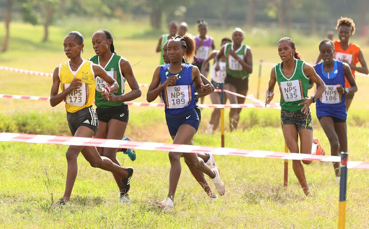 Caroline Nyaga leads Mercy Cherono and Janet Ruguru during the Police Cross Country Championship at Ngong Race Course
