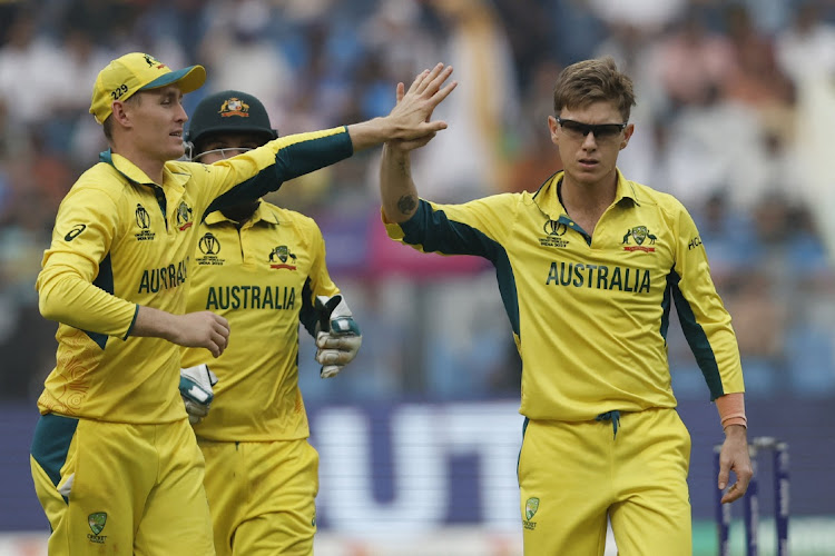 Australia's Adam Zampa celebrates after taking the wicket of Afghanistan's Azmatullah Omarzai in the ICC Cricket World Cup match Wankhede Stadium in Mumbai on November 7.