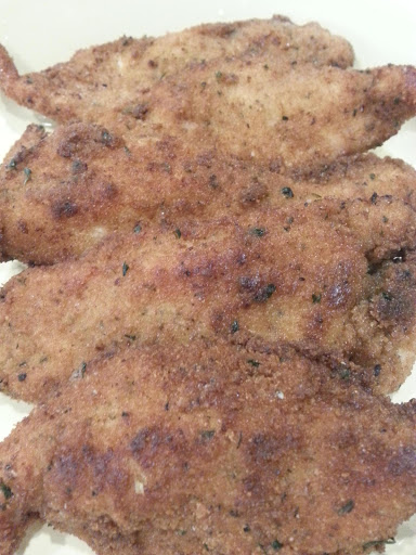 Crispy & Spicy Chicken Strips cooked to a deep golden brown. Delish