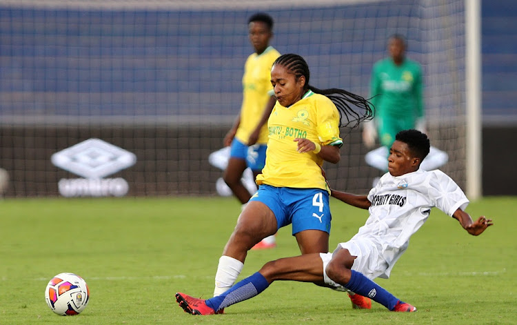 Thalea Smidt of Mamelodi Sundowns is tackled by Mary Ezenagu of Bayelsa Queens in the Caf Women Champions League Group B game at Stade de Marrakech in Morocco on October 31 2022.