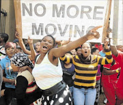 HOUSE US:  Residents of  Plastic View, an informal settlement in Pretoria east, protesting outside the North Gauteng High Court in   Pretoria 
      
       to demand the  construction  of  new low- cost houses
    
        PHOTO:  ANTONIO  MUCHAVE