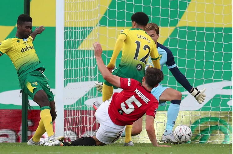 Manchester United's Harry maguire stabs home the winner against Norwich City in a FA Cup quarter-final encounter