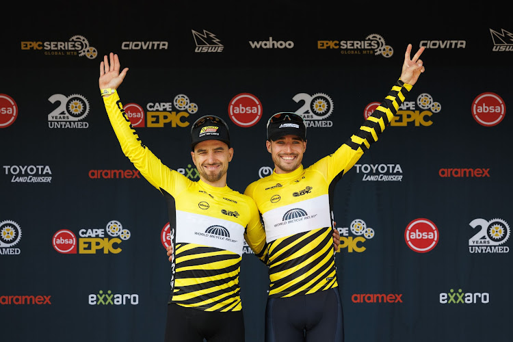 Nino Schurter and Sebastian Fini retained the yellow jersey after stage one of the Absa Cape Epic at Saronsberg Wine Estate in Tulbagh on Monday.