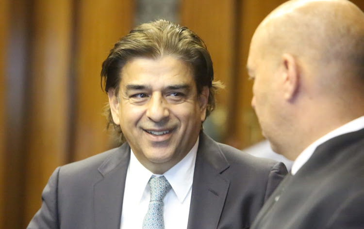 Iqbal Sharma speaks to a legal representative during a court break on day 2 of the Nulane Investments R24.9m fraud and money laundering trial in the Bloemfontein high court.