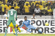 NETTED: Bernard  Parker scores a goal  for Bafana Bafana during the 2014 African Nations Championship match against Nigeria at Cape Town Stadium  in Cape Town last night.  Nigeria won 3-1   Photo: Manus van Dyk/Gallo Images