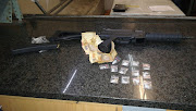 A 26-year-old Manenberg man was arrested in possession of an assault rifle and drugs on Wednesday.