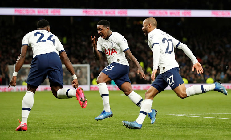 Tottenham Hotspur's Steven Bergwijn celebrates scoring with Serge Aurier and Lucas Moura in the English Premier League at Tottenham Hotspur Stadium, London, on February 2, 2020