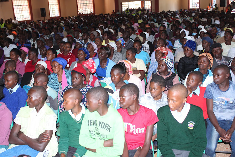 Some of the 6,000 beneficiaries of Kigumo NG-CDF bursaries at Kigumo Social Hall.