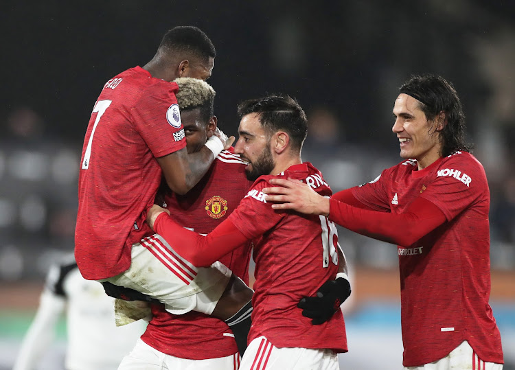 Manchester United's Paul Pogba celebrates scoring their second goal with Fred, Bruno Fernandes and Edinson Cavani