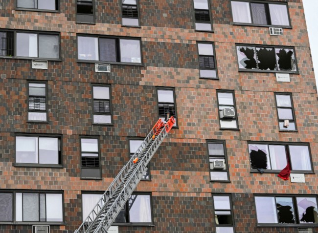 Emergency personnel from the FDNY respond to an apartment building fire in the Bronx borough of New York City, U.S., January 9, 2022.