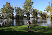 Benjamin Runganga at the Bloemhof Golf Club, where a large area is under water.