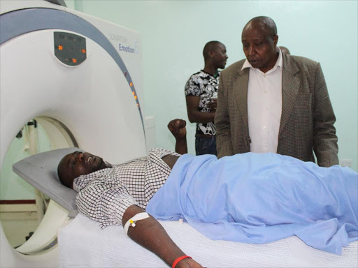 MCA aspirant Samuel Mwangi undergoing an X-ray in a private hospital after he was allegedly tortured by the police. /STAR REPORTER