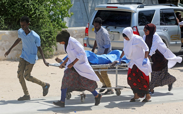 Nurses at the Medina hospital assist a civilian wounded in an explosion outside a hotel near the international airport in Mogadishu, Somalia July 22, 2019.