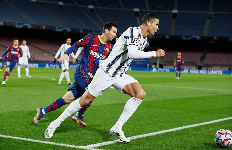 Lionel Messi in action with Cristiano Ronaldo during a past Champions League match