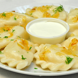 Potato Pierogies with fried onion + Sour Cream (6 Pieces)