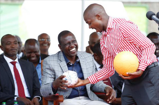 Deputy President William Ruto and Football Kenya Federation chairman Nick Mwendwa during the launch of Chevrolet and One World Play Project at Safaricom Stadium Kasarani in Nairobi, February 12, 2016. Photo/DPPS