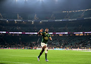 Bok captain Siya Kolisi goes on a celebratory run after his team defeated the All Blacks 35-7 at Twickenham last year. 