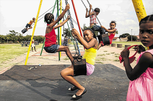 INNOCENTS: Eldorado Park children play in a park where residents say drugs are sold. At an inter-high school sports day on Friday, pupils not taking part in the activities were seen drinking alcohol and smoking dagga in the streets around a stadium.