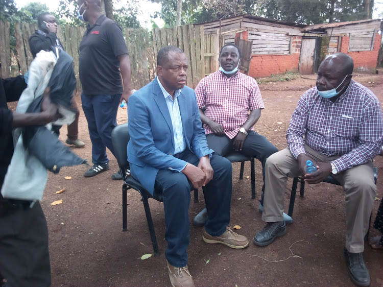 Charles Gimose MP hamisi sitting behind his house With Mumias East MP Ben Wasiali after police had lobbed to them several tear gas within the compound.