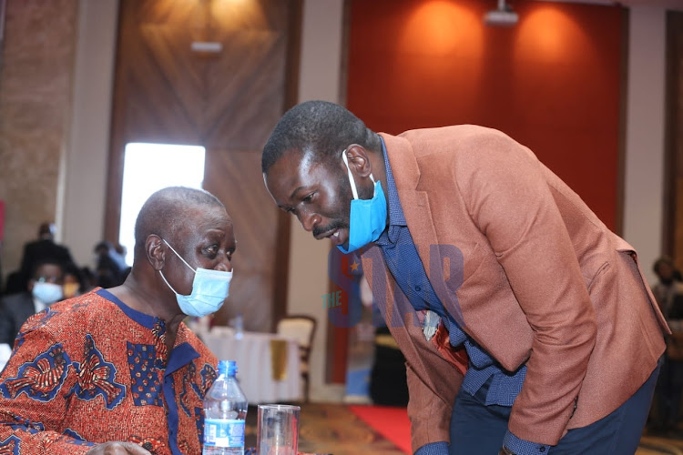 Oburu Odinga (L) chats with ODM Secretary General Edwin Sifuna during the fundraiser of Dr. Ida Odinga Library Research,Innovation and Resource Centre on August 28 2020 at the Ole Sereni Hotel Nairobi./Photo/Fredrick Omondi