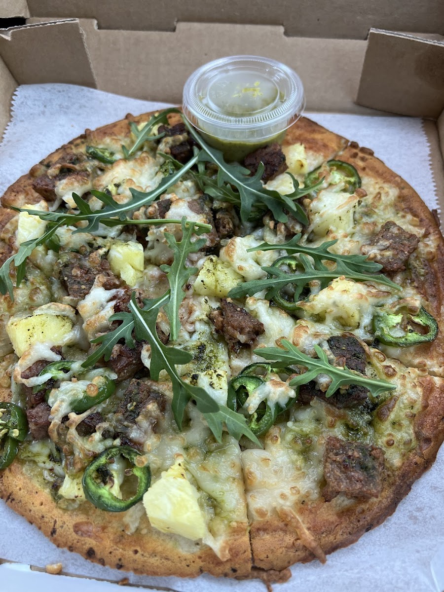 Green umami pizza with beyond meat on a gluten free crust