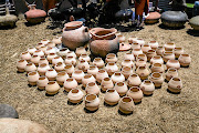 Dyalvane presented the people of Ngobozana with 100 terracotta beer pots to use for drinking umqombothi. The gesture recalls an earlier gift about 10 years ago, when he returned home bearing a unique clay vessel for his father, to replace the plastic or metal buckets that had become common. The moment was a profound awakening for Dyalvane, setting in motion a renewed interest in traditional Xhosa culture among his community.