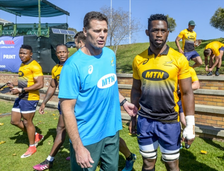 Captain Siya Kholisi with coach Rassie Erasmus of the Springboks during the Springbok training session at St Stithians College on May 28, 2018 in Johannesburg, South Africa.