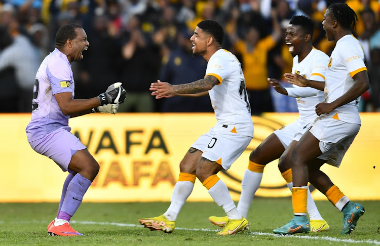 Kaizer Chiefs players celebrate with goalkeeper Itumeleng Khune after winning the penalty shootout in the MTN8 quarterfinal at Danie Craven Stadium in Stellenbosch on August 28 2022.