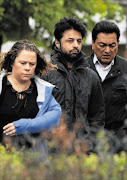 Shrien Dewani, centre, leaves Belmarsh Magistrate's Court, London, after a session of his extradition hearing Picture: ZED JAMESON