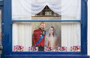 Royal wedding decorations hang in a shop window on May 17 2018 in Windsor, England.