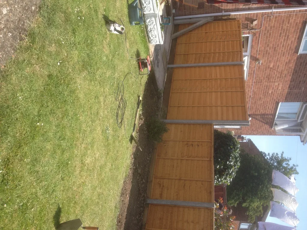 Fencing Remove old wooden fence posts and panels and replace with concrete posts and new panels