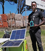 Gcina Dzingwe with the BabyTurtle solar panel.