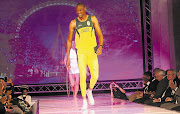 Olympic medallist long jumper Khotso Mokoena models South Africa's new Olympic and Paralympic kit at the Turbine Hall in Newtown, Johannesburg, last night. The Olympic and Paralympic Games will be staged in London later this year Picture: SYDNEY SESHIBEDI