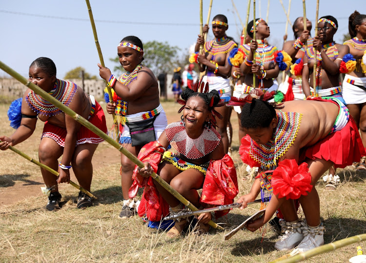 Princess Tensindiso lifts her reed during Umkhosi Womhlanga at Emachobeni Royal Palace in Ingwavuma.