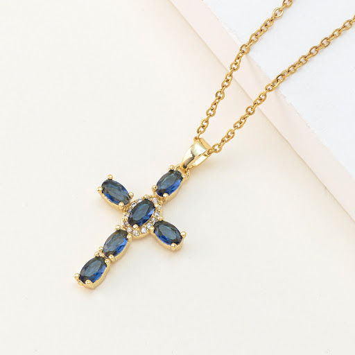 Title 12, Delicate chain item featuring a colorful zircon...