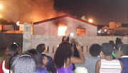 A Khayelitsha residence, believed to be that of Uyinene Mrwetyana's attacker was set alight on Tuesday night. 