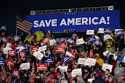 People wait for former US President Donald Trump to speak during a rally to boost Pennsylvania Republican US Senate candidate Dr. Mehmet Oz ahead of the May 17 primary election at the Westmoreland Fairgrounds in Greensburg, Pennsylvania, US May 6, 2022. Picture taken May 6, 2022. 