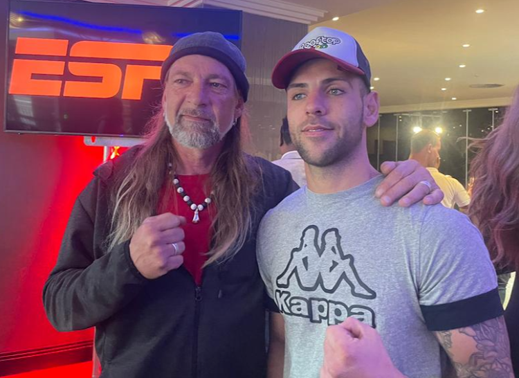 Gert Strydom, left, poses with his son Shannon at the weigh-in on Wednesday. They will man opposing corners at the ESPN tournament on Thursday night.