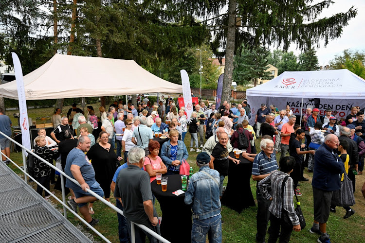 People attend a SMER-SSD party's election campaign rally, ahead of Slovakia's early parliamentary election in Banovce nad Bebravou, Slovakia, on September 14 2023.