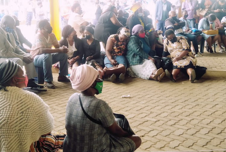 Scores of people sat on the floor at the Nongoma taxi rank where a public viewing site had been set up for the memorial service of King Goodwill Zwelithini.