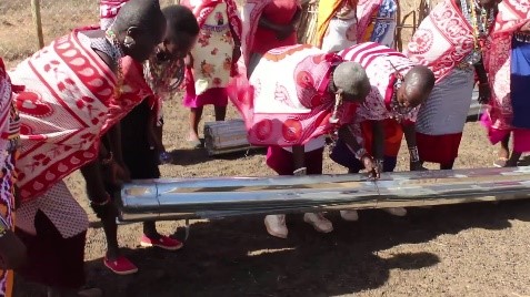 Women in Kajiado County receive roofing sheets for water harvesting. Courtesy