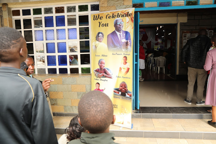 A portrait of six family members who perished in a road crash at Mlima Kiu along Mombasa road stands at the entrance of PCEA Lanet church during a memorial service in their commemoration.