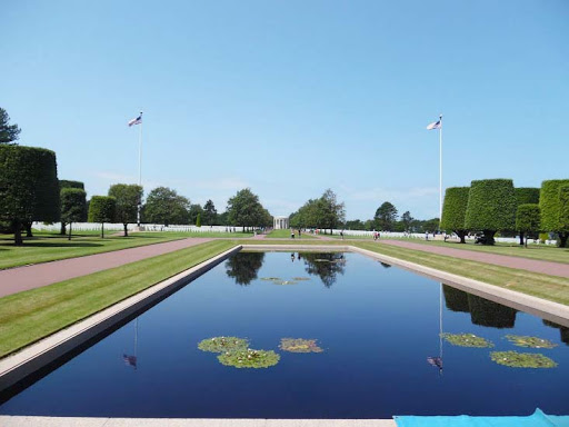 Flags flutter above a memorial tidal pool.