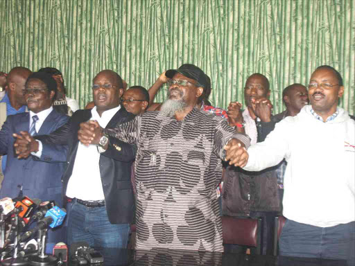 Uasu officials led by Secretary General Constantine Wasonga, chairman Munga K'Olale and vice chair Joseph Mberia after a press briefing at a Nairobi hotel, March 18, 2018. /JOSEPH NDUNDA