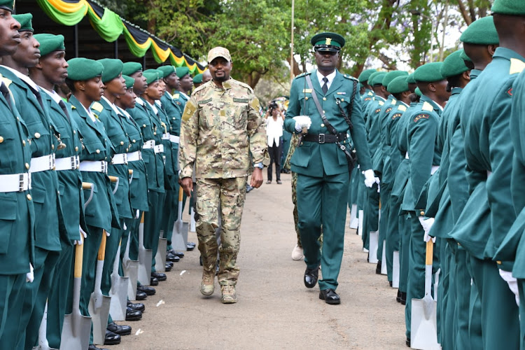 Public Service CS Moses Kuria inspecting the guard of honour at the NYS re-engineering program in Ruaraka, Nairobi on Wednesday, October 25,2023.