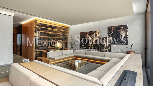 Modern living room with built-in sectional sofa - Luxury property for sale in Mexico City, 4 bedrooms
