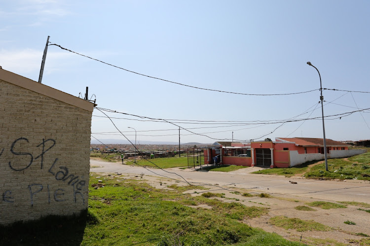 In Auburn Street, Booysens Park, the door to the substation is open and live wires cross the road.